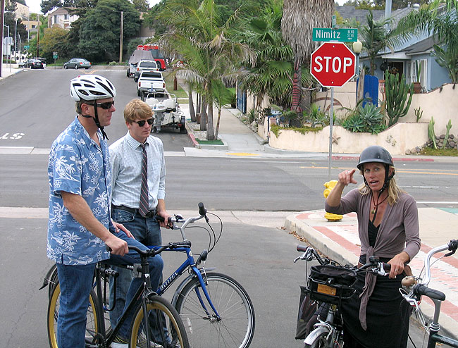 Councilmember Faulconer (in Hawaiian shirt), Council representative Michael Patton (with tie) listening to founder of District 2 bike/ped working group, Nicole Burgess, explain exactly why Nimitz Boulevard could become safer with some design treatments. 