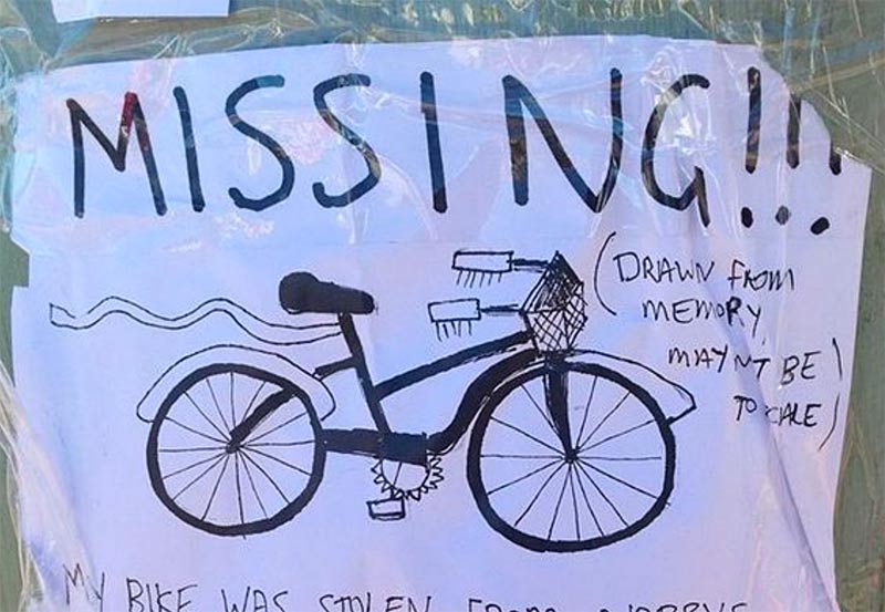 Poster of for stolen bike with drawing of a missing bike in black marking pen.